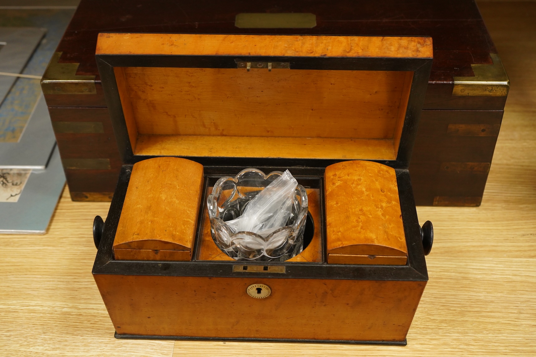 A bird’s-eye maple tea caddy and a brass mounted writing slope, latter 50cm wide